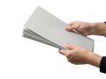 Hands carefully holding a stack of light gray paper sheets Royalty Free Stock Photo