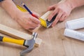 Hands of carpenter drawing with pencil wooden Royalty Free Stock Photo