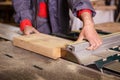 Hands carpenter working with a circular saw Royalty Free Stock Photo