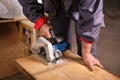 Hands carpenter working with circular saw Royalty Free Stock Photo