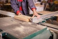 Hands carpenter working with a circular saw Royalty Free Stock Photo