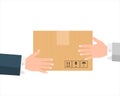 Delivery man`s hands giving cardboard package to client. Royalty Free Stock Photo