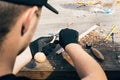 Hands carving spoon from wood, working with chisel close up. Wooden workshop. Process of making wooden spoon, chisel, pencil, Royalty Free Stock Photo