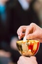 Hands of a catholic priest with chalice and host at Communion Royalty Free Stock Photo