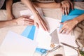 Hands of a caucasian girl and her brother are cutting paper snowflakes with scissors. Handmade, christmas decorations, family Royalty Free Stock Photo