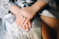 Hands of young caucasian woman with creative manicure and wedding and engagement rings Royalty Free Stock Photo