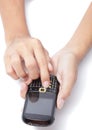 Hands on cellphone typing SMS