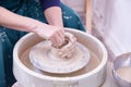 hands of a ceramist make dishes on a potter& x27;s wheel. Royalty Free Stock Photo