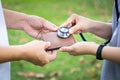 Hands checking wallet with stethoscope,take care,support and be concerned about of money problems,financial health care,money Royalty Free Stock Photo