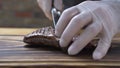 Hands chef cook cutting meat steak on slices close up. Cook cutting grilled meat on wooden board. Process cooking food