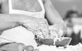 Hands of chef cook working with dough and flour. Bakery concept. Bowl with dough, rolling pin and flour scattered all Royalty Free Stock Photo