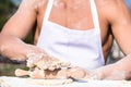 Hands of chef cook working with sticky dough and flour. Bakery concept. Hands of muscular baker or cook kneading raw Royalty Free Stock Photo