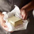 Hands of a chef holding a pat of herb butter Royalty Free Stock Photo