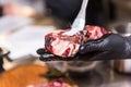 The hands of the chef lubricate raw meat