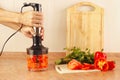 Hands chefs chopped red pepper in blender Royalty Free Stock Photo