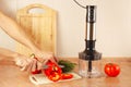 Hands chefs cut bell pepper on kitchen table Royalty Free Stock Photo