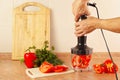 Hands chefs are going to shred red pepper in blender Royalty Free Stock Photo