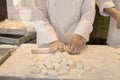 Hands of chefs making dough for grilled rice dumplings in Chinatown in Kobe in Japan Royalty Free Stock Photo