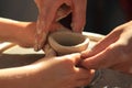 Hands of child and adult potter's Royalty Free Stock Photo