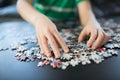 Hands of a child doing a puzzle Royalty Free Stock Photo