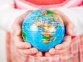 Hands of a child holding globe Royalty Free Stock Photo