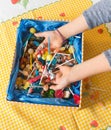 Hands of a child inside a candy box. Royalty Free Stock Photo