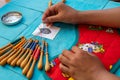 Hands of child making bobbin lace. Colorful lace threads Royalty Free Stock Photo
