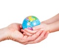 Hands of a child and a man holding globe Royalty Free Stock Photo