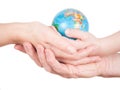 Hands of a child, a man and a woman holding globe Royalty Free Stock Photo