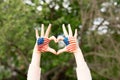 Hands of child painted in American flag color in heart shape. Patriotic holiday. Independence Day, Flag Day, 4th July Royalty Free Stock Photo