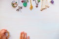 childrens hands play with light summer bijouterie, on white background. concept of womens happines. Copy space