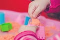 The hands of a child playing with kinetic sand Royalty Free Stock Photo