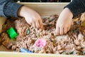 The hands of a child playing with kinetic sand Royalty Free Stock Photo