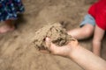 Hands of child playing with sand outdoor Royalty Free Stock Photo