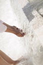 Hands of a child in a stream of clear water. Ecological concept. Problems of lack of drinking water Royalty Free Stock Photo