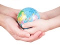 Hands of a child and a woman holding globe Royalty Free Stock Photo