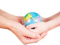 Hands of a child and a woman holding globe Royalty Free Stock Photo