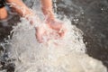 Hands of Children Cupped under canal water.