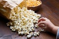 Hands of children eating popcorn Royalty Free Stock Photo