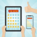 Hands choosing five stars rating on gadgets