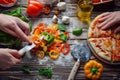 hands chopping bell peppers, surrounded by other pizza toppings