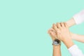 Hands clasped collaboration top view of individuals bringing their hands together to signify unity and teamwork Royalty Free Stock Photo