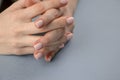 Hands clasped together for a prayer, waiting gesture, negotiations. Caucasian female woman clasping hands with perfect