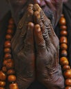 Prayer hands with rosary beads, close-up. The concept of religion and spirituality.