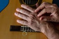 Hands of a classical guitarist on top of the guitar. Study of classical music Royalty Free Stock Photo