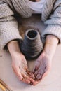 Hands in clay in pottery ceramics workshop