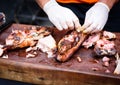 Hands cleaning Grilled spare beef or pork ribs from smoker. Royalty Free Stock Photo