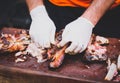 Hands cleaning Grilled spare beef or pork ribs from smoker. Royalty Free Stock Photo