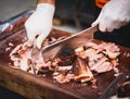 Hands cleaning Grilled spare beef or pork ribs from smoker. Royalty Free Stock Photo