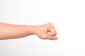 Hands clenched fists isolated on a white background. Close-up of female hand reaching out with a clenched fist Royalty Free Stock Photo